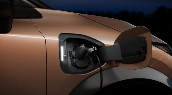 Close-up image of charging cable plugged in | Merchant Nissan in Troy AL